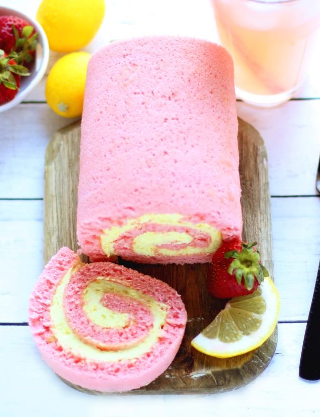 Strawberry Lemonade Cake Roll with strawberry and lemon as garnish