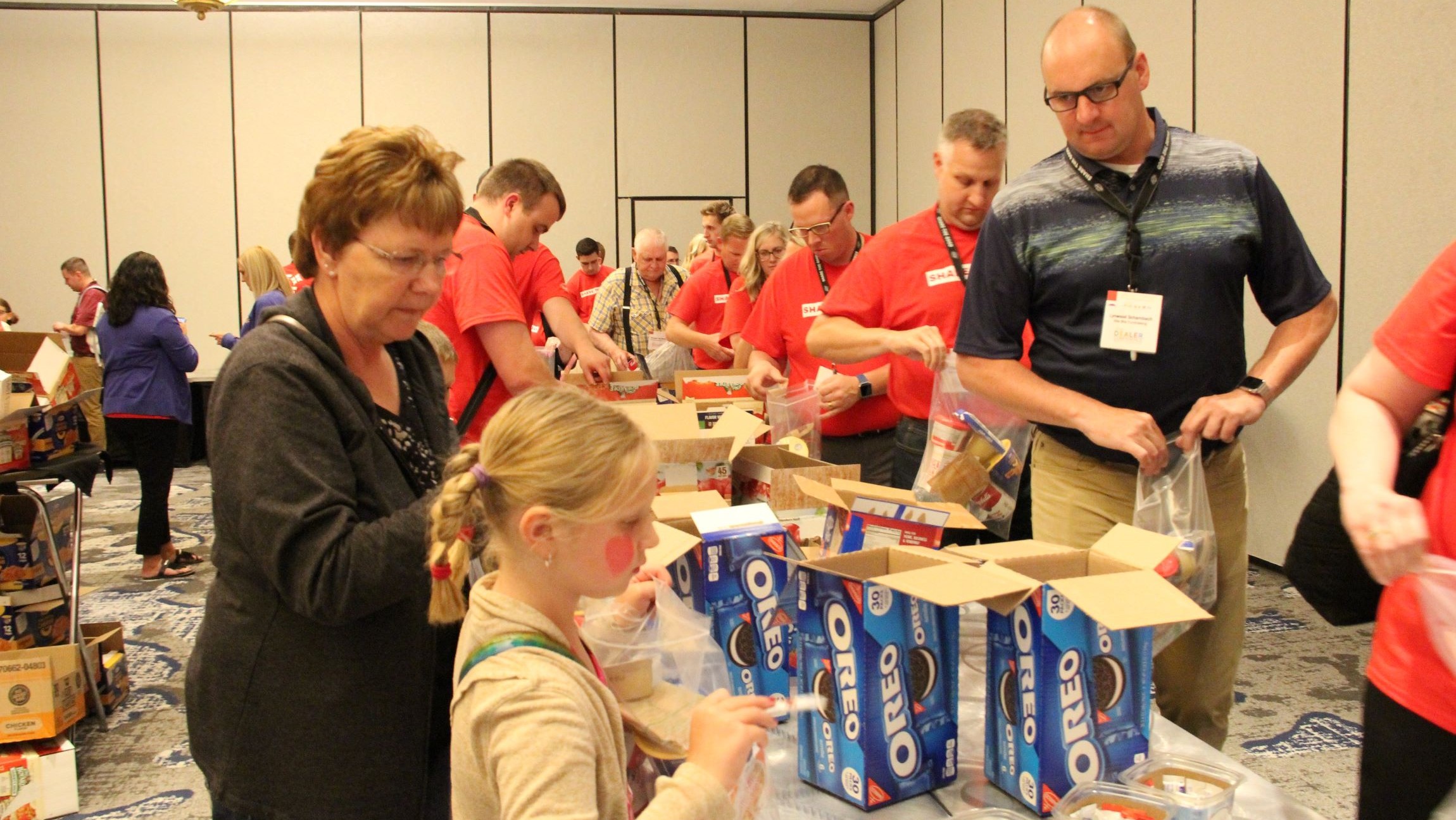 Group of people packaging bags with goodies